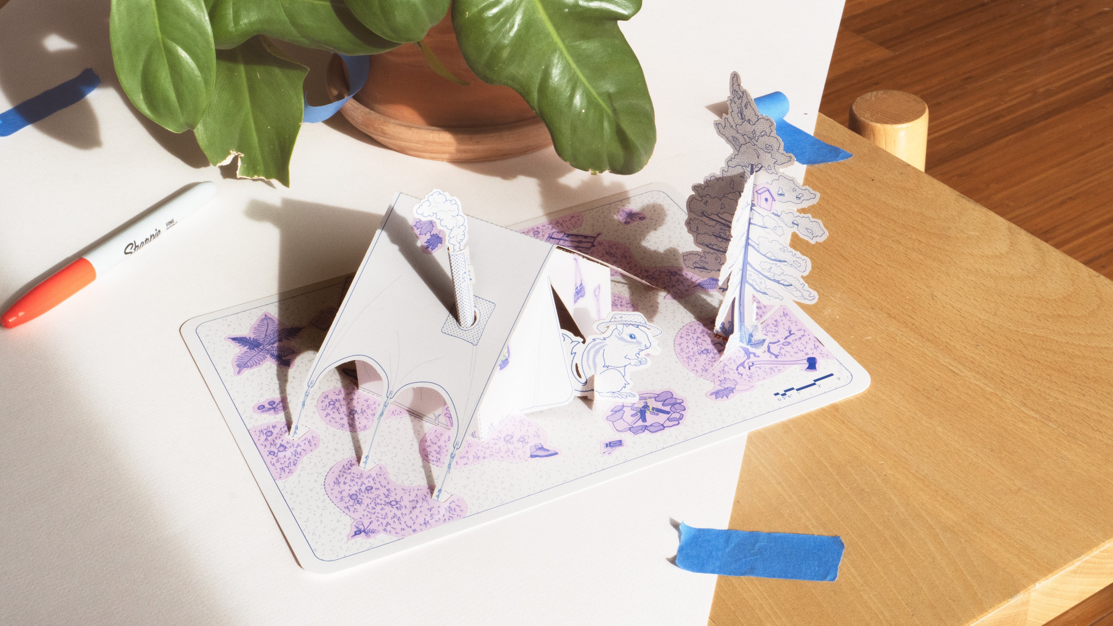 Creative playsets for adults and kids, art activities, and open ended toys. Thiskind Chipmunk Cozy Camping kit is a paper model kit. Create your own scene with a model hot tent, wood burning stove, tree, camping sticker accessories and two cute chipmunk pals.
